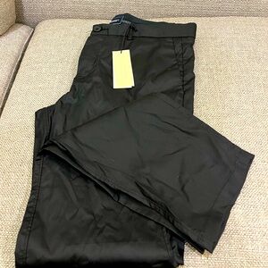 Brand new 7Diamond performance pants in size 30/32.  Versatile navy fabric.